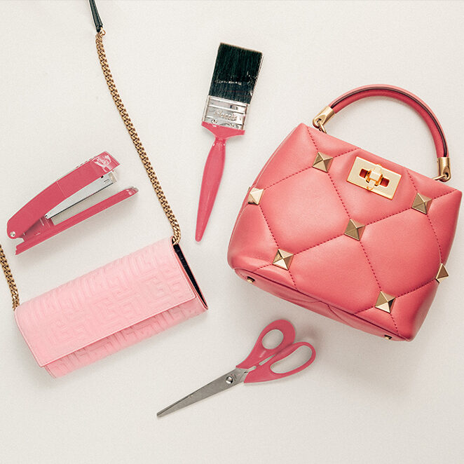 A stapler, paintbrush, handbag, scissors and a purse all pink in colour